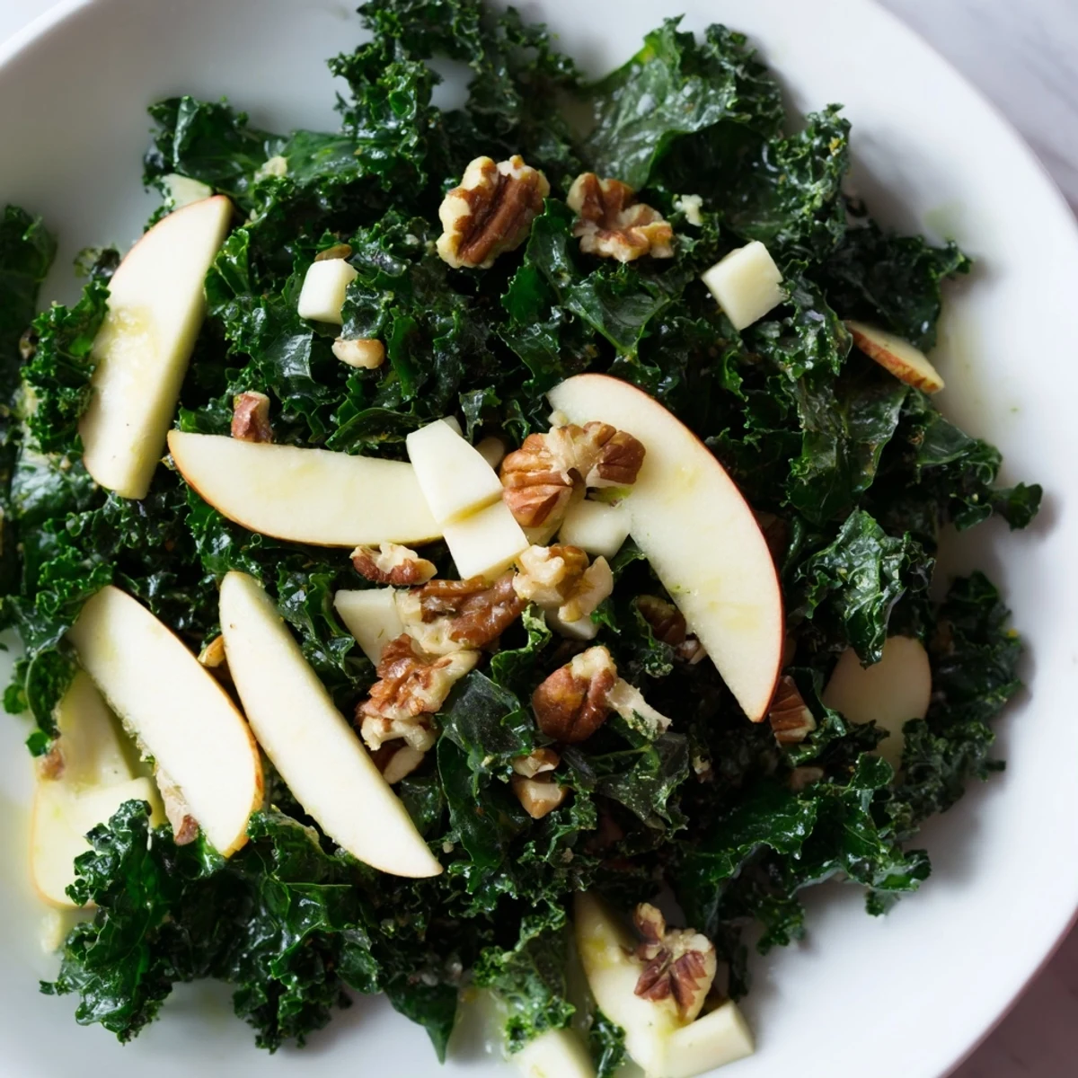 Freshly massaged kale, crisp apple slices, sharp cheddar cubes, and toasted pecans tossed in a zesty apple cider vinaigrette.