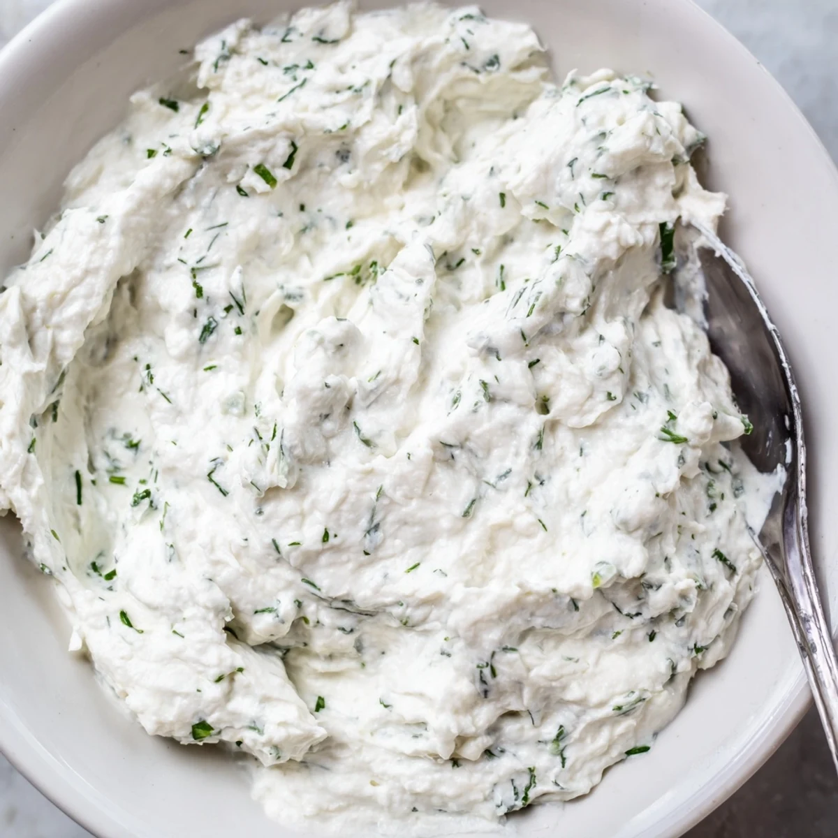 Creamy Appetizer Spread Dip served with crisp crackers and fresh vegetables like celery and bell pepper slices.