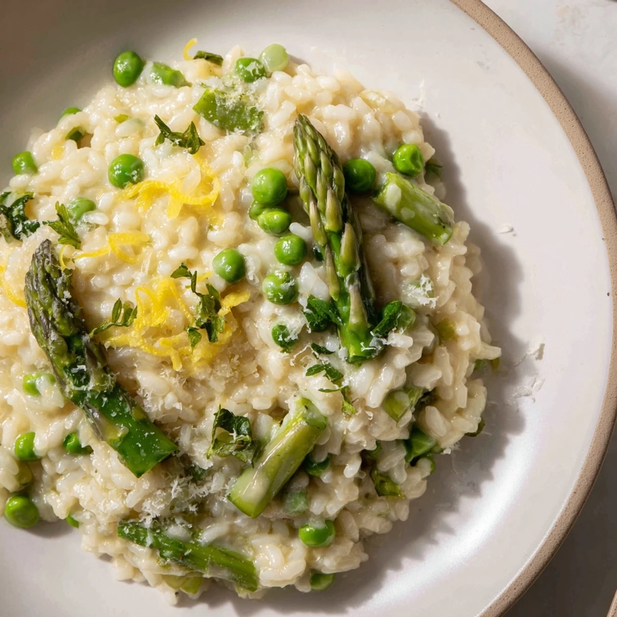 Spring Pea and Asparagus Risotto served hot with tender green asparagus and bright peas mixed into creamy rice.