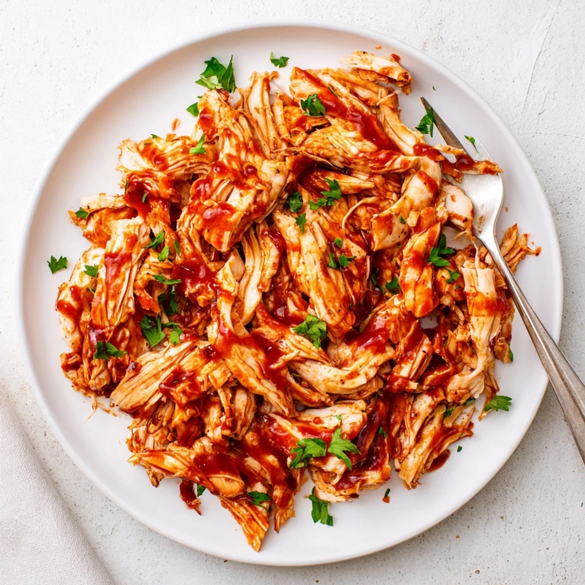 Golden pieces of tender chicken glisten in a rich barbecue glaze inside a slow cooker. The Sweet Baby Rays Crockpot Chicken looks juicy, sweet, and perfect for a family dinner.