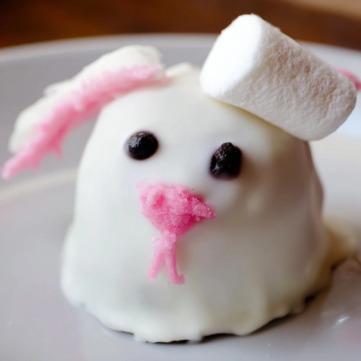 Adorable Easter bunny Oreo truffles featuring edible eyes, pink noses, and cute pointed ears made from mini marshmallows
