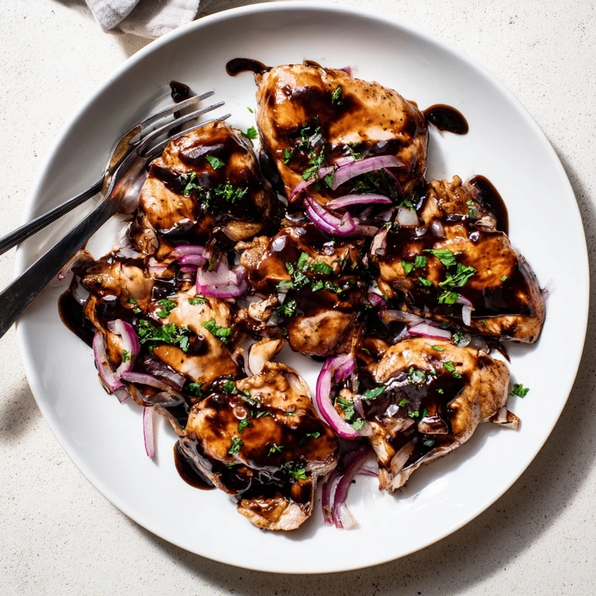 Golden slow cooker balsamic chicken thighs coated in rich glossy dark sauce