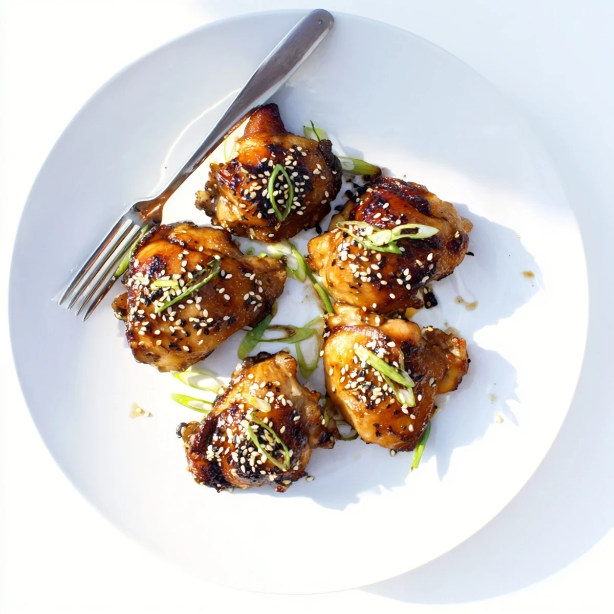 Tender garlic miso chicken dinner served with steamed rice showing succulent texture and rich umami marinade coating