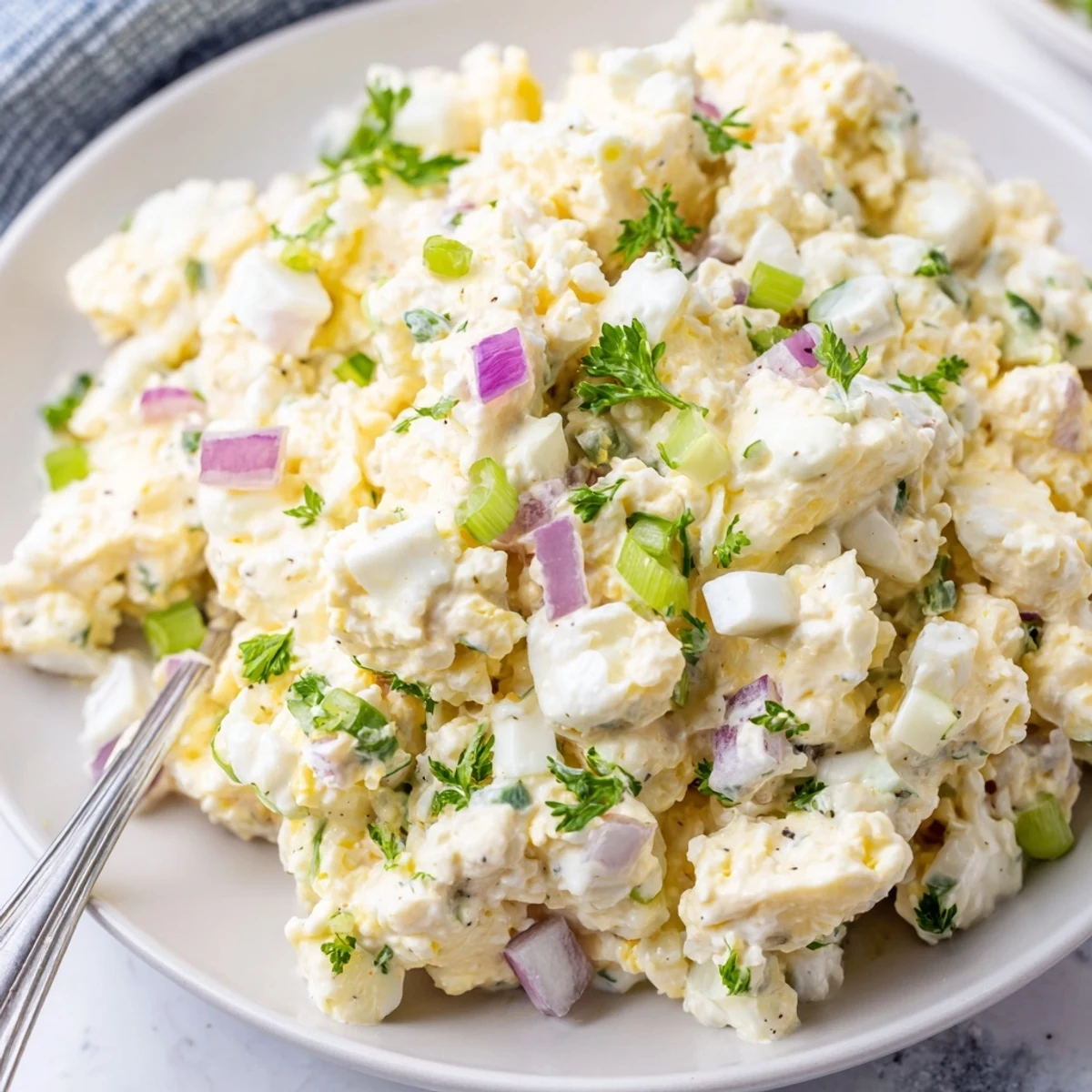 Golden chopped eggs mixed with smooth cottage cheese and crisp diced celery
