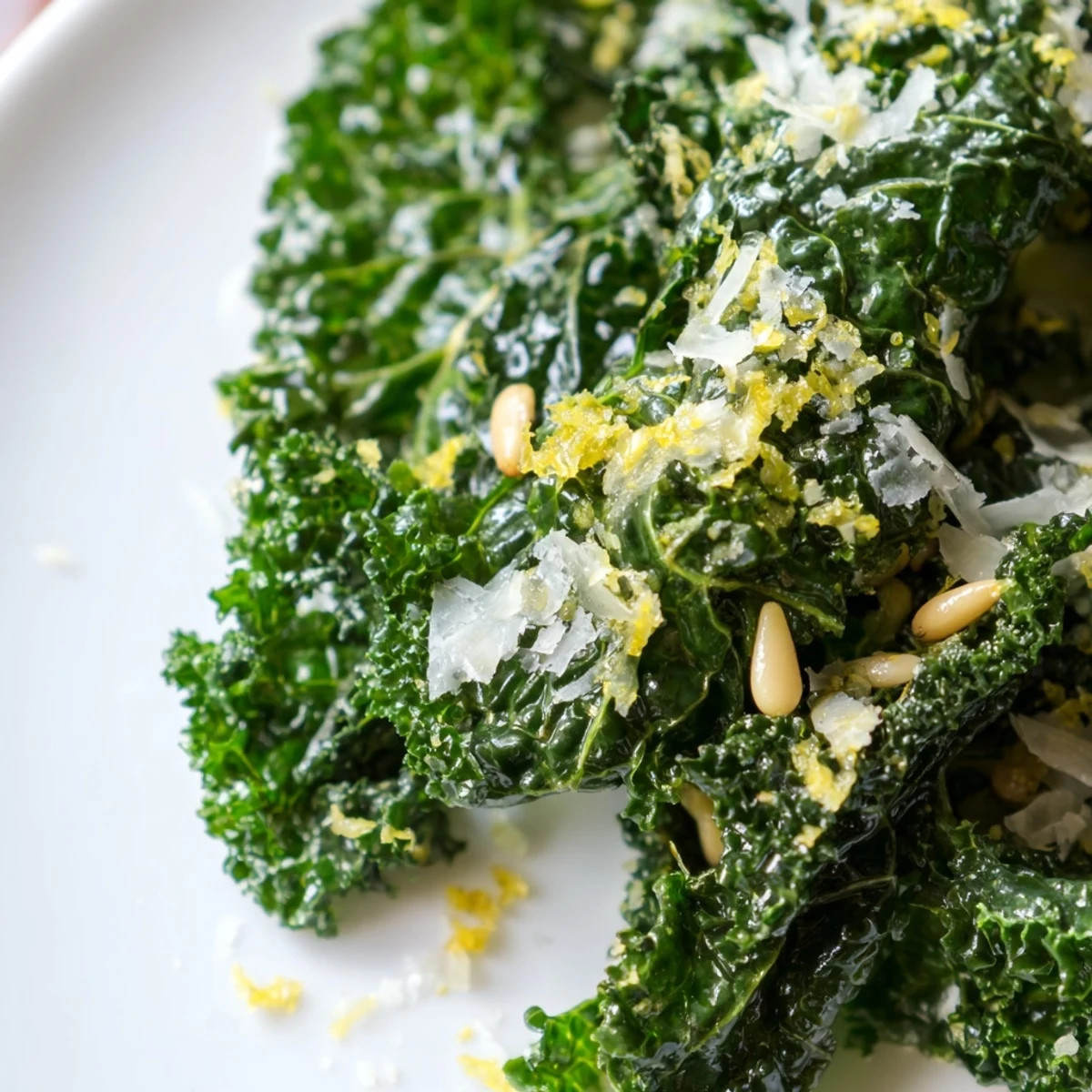 Fresh massaged kale leaves coated in zesty garlic lemon parmesan dressing