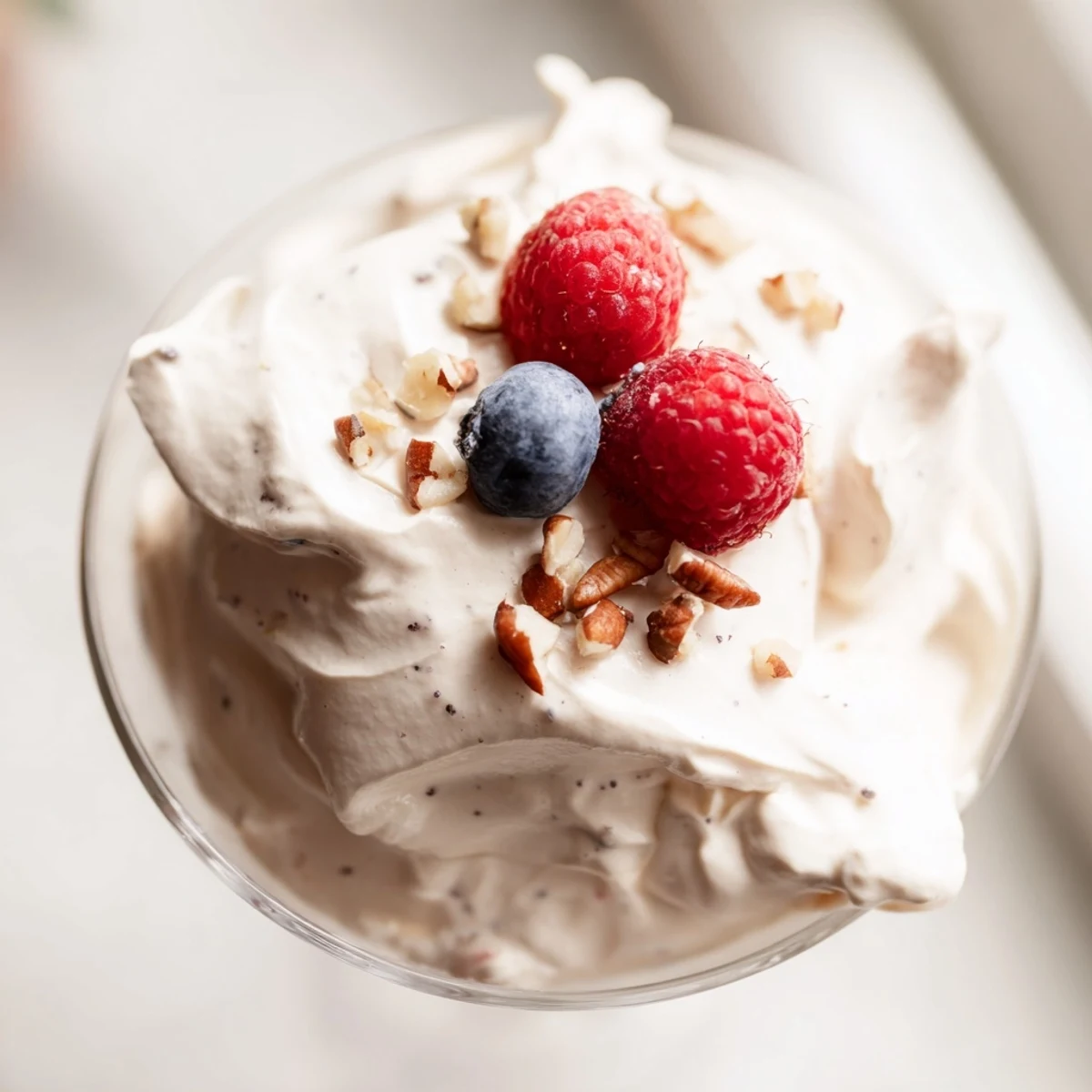 Light and airy keto cheesecake fluff with smooth texture served in small dessert bowls