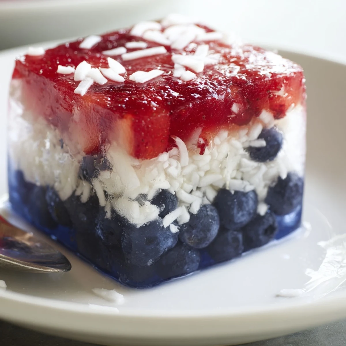 Close-up of Red White And Blue Ice Cubes Recipe chilling a sparkling lemonade.