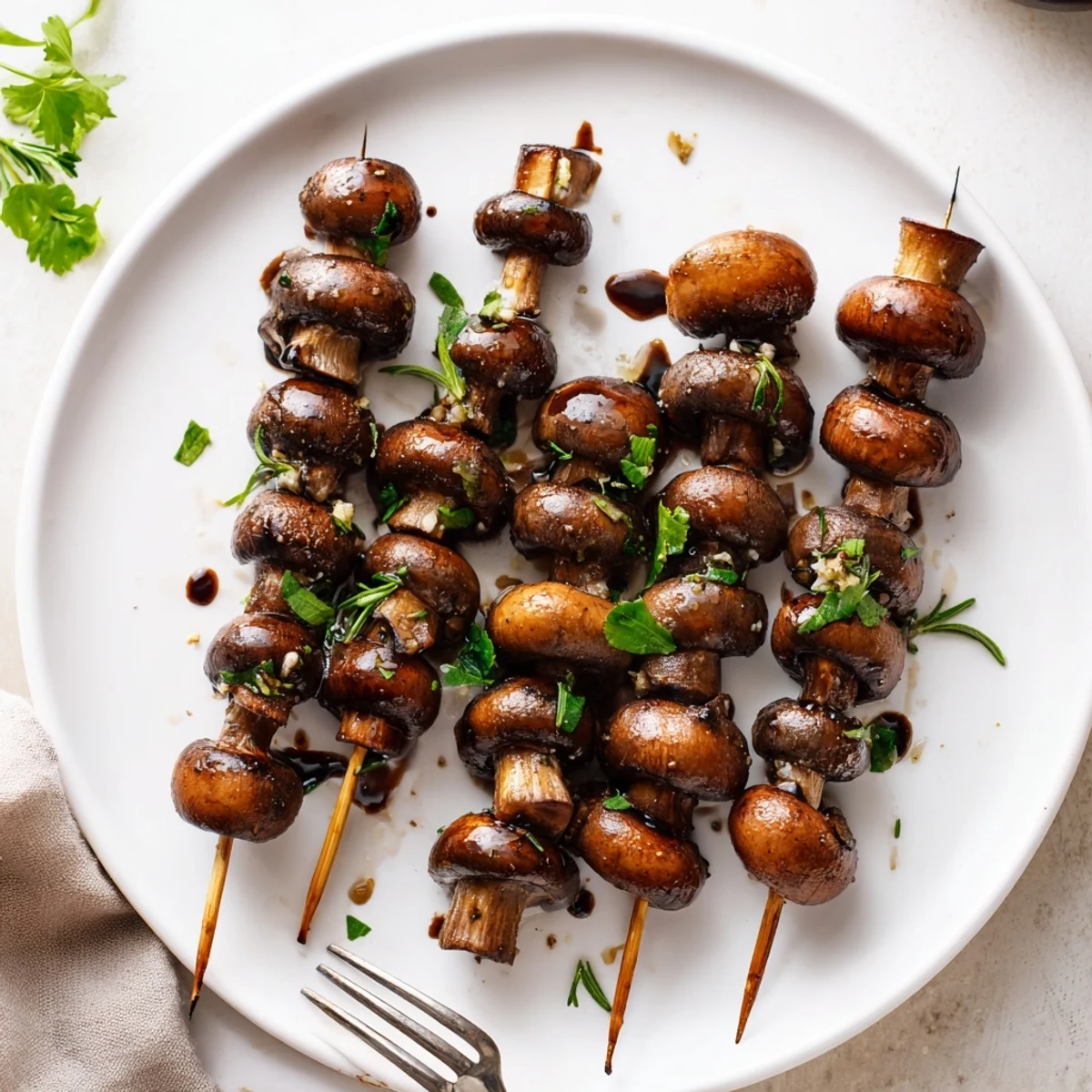 Smoky, tender Balsamic Garlic Grilled Mushroom Skewers served with crusty bread.