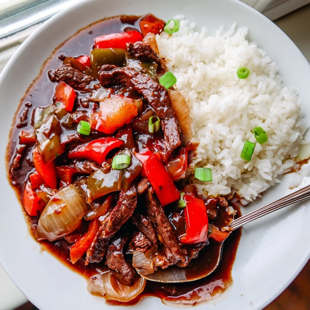 Slow Cooker Pepper Steak with tender beef strips and colorful bell peppers in savory sauce