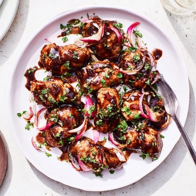 Tender chicken thighs simmered in tangy sweet balsamic glaze with caramelized onions